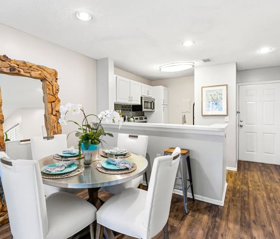 Open Concept Kitchen & Dining Room Area With Wood-Style Flooring