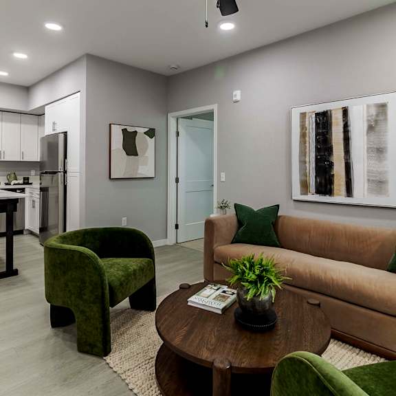 a kitchen with white cabinets and stainless steel appliances  at Arrive Vacaville, California, 95687