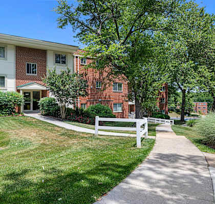 our apartments are located in a quiet neighborhood with trees and grass