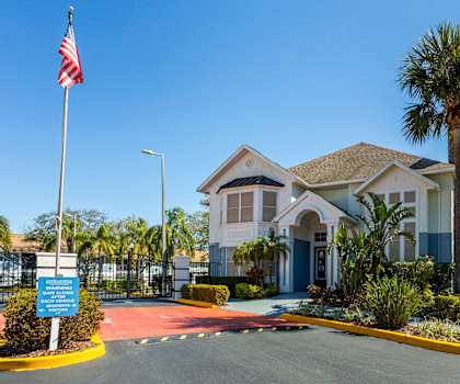 A building with a flag on a pole in front of it.