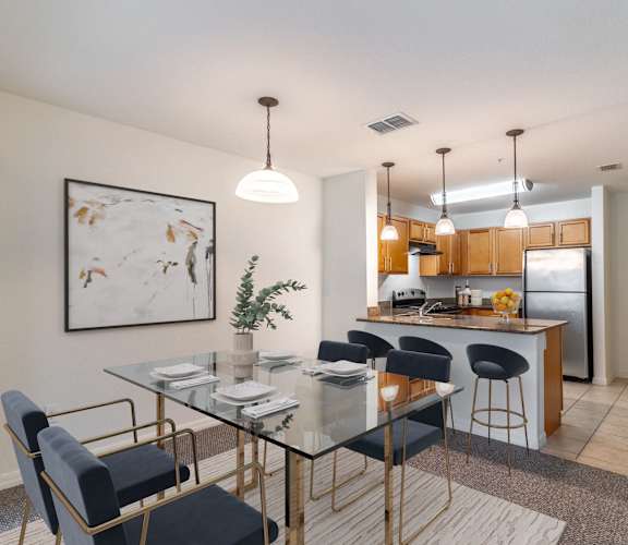 A modern dining area with a glass table and chairs.