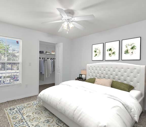 a bedroom with white walls and a white bed with a white tufted headboard