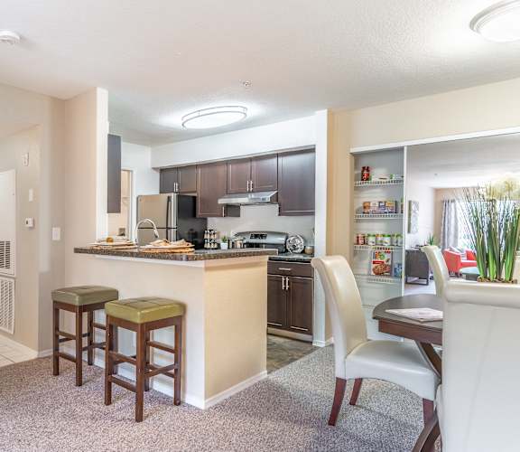 a kitchen and dining area in a 555 waverly unit