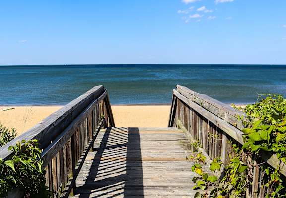 a wooden boardwalk leading to the beach at Gates of West Bay, Norfolk