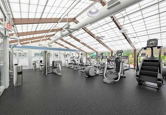 a gym with treadmills and other exercise equipment