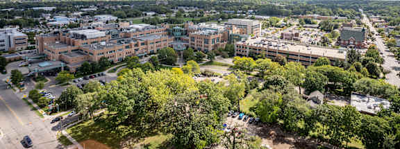 an aerial view of a city with buildings and trees