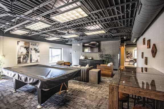 A room with a trampoline in the middle of it.