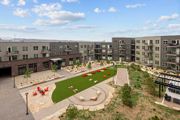 A large apartment complex with a courtyard and landscaping.
