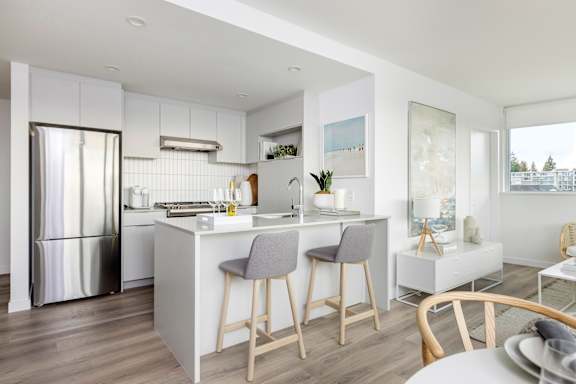 a kitchen and living room in a 555 waverly unit