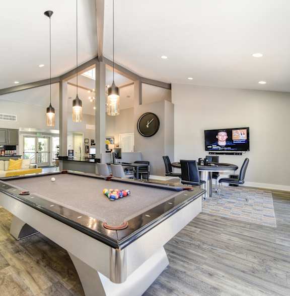 a billiards table in a hotel room with a blue pool table