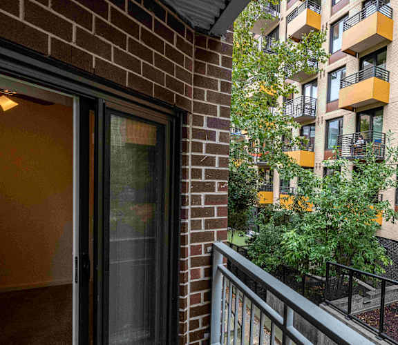 a balcony with a view of an apartment building
