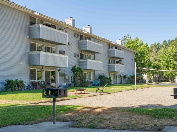 volleyball court at the whispering winds apartments in pearland, tx  at Ironwood Apartments, Coeur d'Alene, 83814