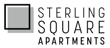 A green sign with white text that says Sterling Square Apartments.