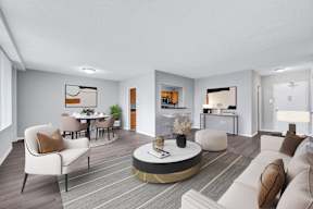 A modern living room with a grey and white color scheme.