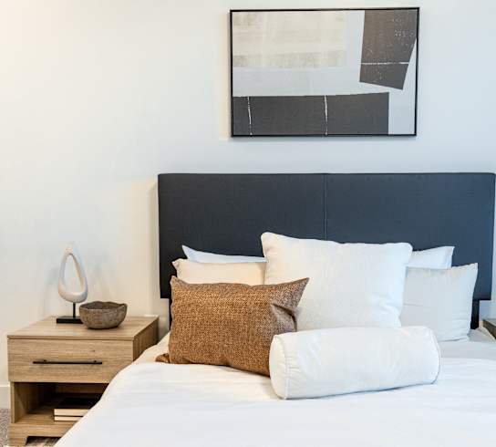 Bright Bedding in Bedroom at The Arza Apartments in American Fork, UT