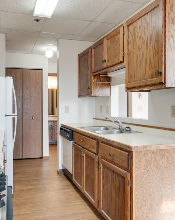 a kitchen with a stove a refrigerator and a microwave