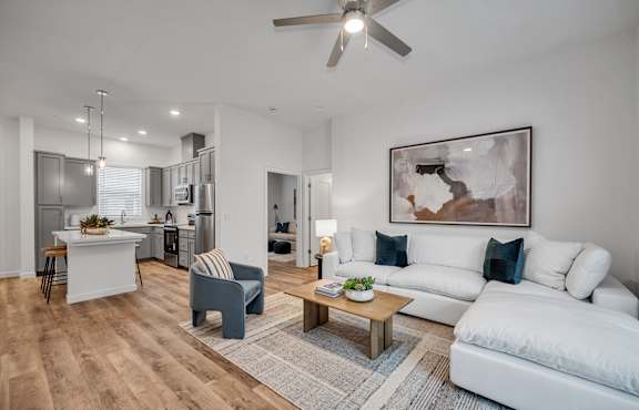 Living room with large couch at Estia Roseville Apartments, Roseville