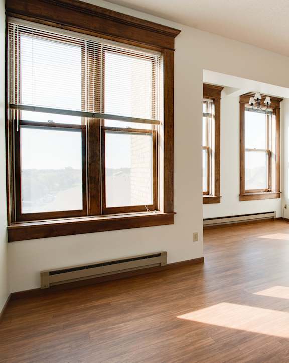 a bedroom with a bed and a window at Block 6 Apartments, Fargo, 58103