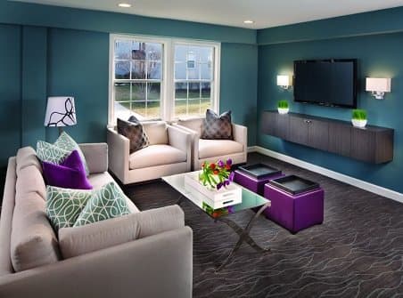 a living room filled with furniture and a flat screen tv at Myerton Apartments, VA