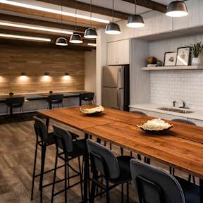 a kitchen and dining room with a wooden table