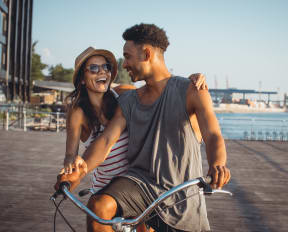 Two people riding a bike