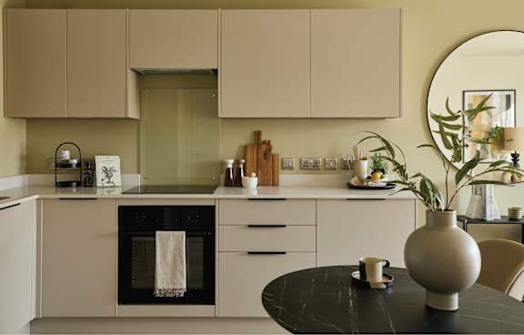a kitchen with navy blue cabinets and a white counter top