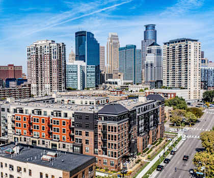 An arial view of Gatsby Apartments with a view of the cityscape.