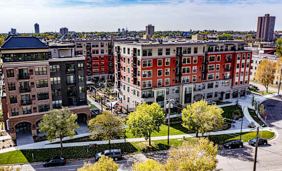 An arial view of Gatsby Apartments with a view of the cityscape.