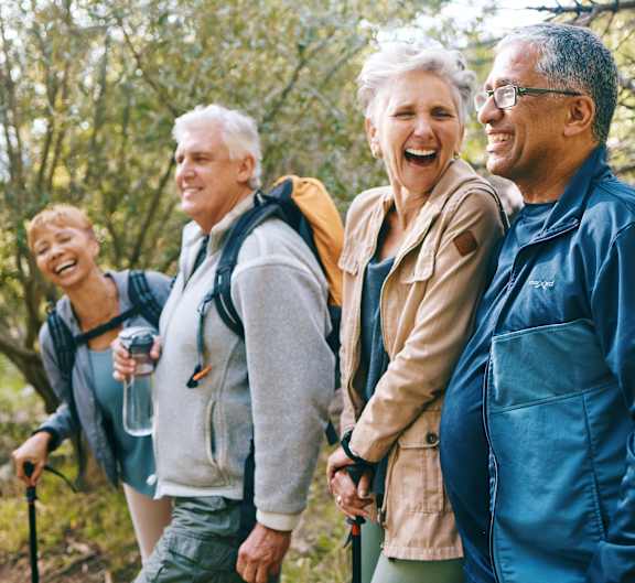 Group of people hiking in the woods at Lakeview Senior Living Apartments, Lakewood, CO 80227