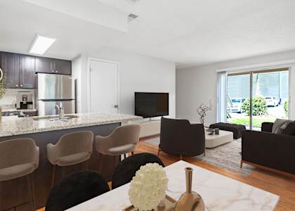 a kitchen and living room in a 555 waverly unit