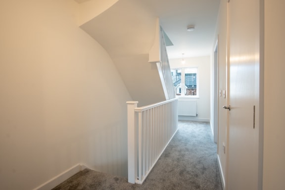 a view down the stairs from the top of the stairs