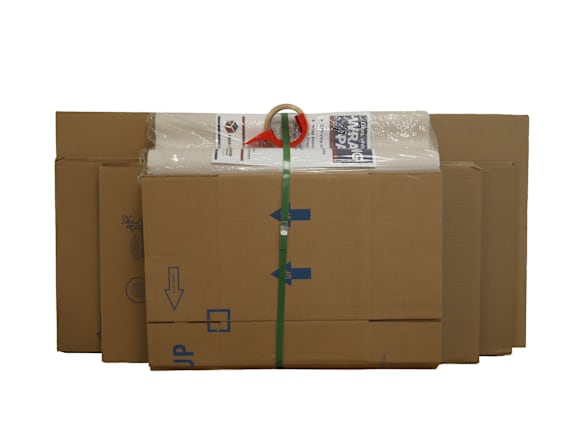 A globe and cardboard boxes are stacked in the foreground.