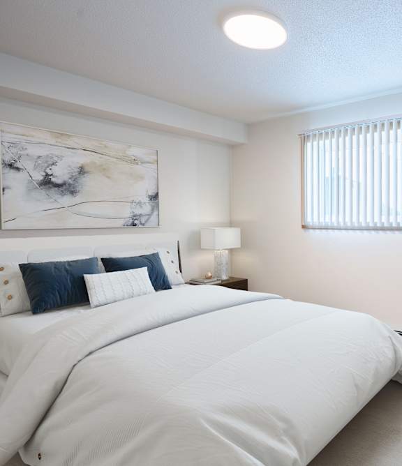 Bismarck, ND Stonefield Townhomes | a bedroom with a bed and a closet