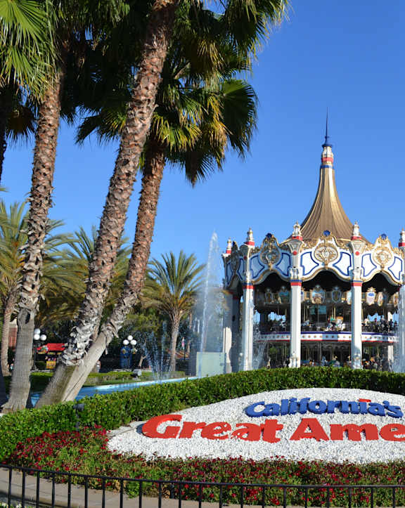 A sign that says "California's Great America" is in the foreground of a picture.
