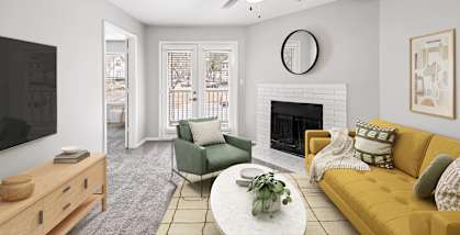 a living room with a ceiling fan and a fireplace