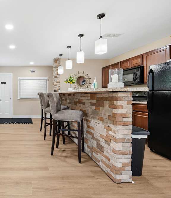 Kitchen with a bar area at Windsor Harbor Apartments, Charlotte, North Carolina