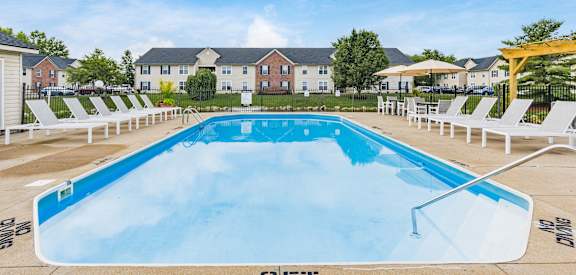 our apartments have a resort style pool with lounge chairs and umbrellas