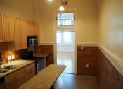 Thumbnail 3 of 14 - an alternate view of the kitchen and living room