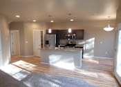 Thumbnail 11 of 21 - kitchen with island, dining area, unfurnished
