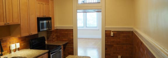 an alternate view of the kitchen and living room