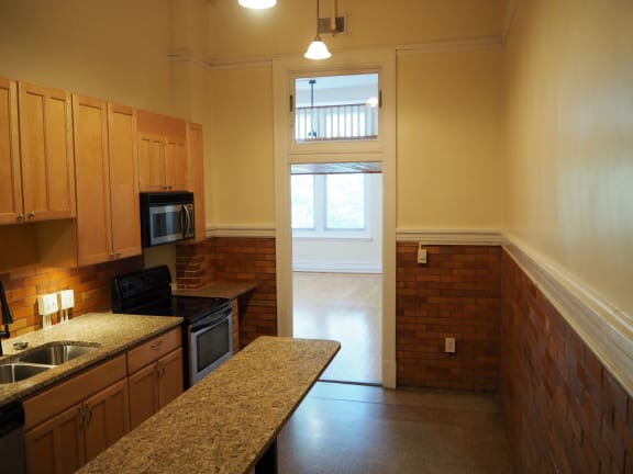 an alternate view of the kitchen and living room