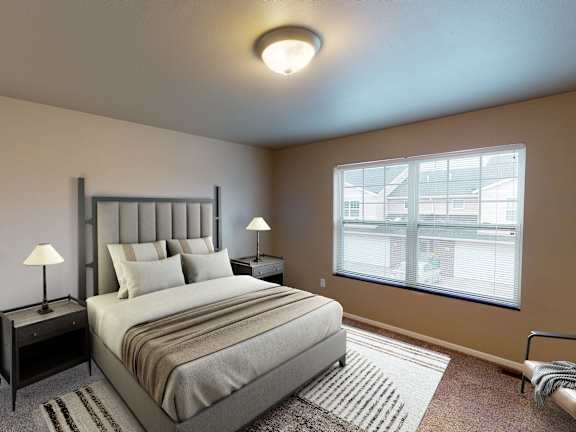 A bedroom with a large bed and a window overlooking a building.