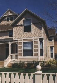 a woman sitting on a chair in a window