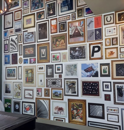 a wall full of framed art at Canter, Florida, 34474