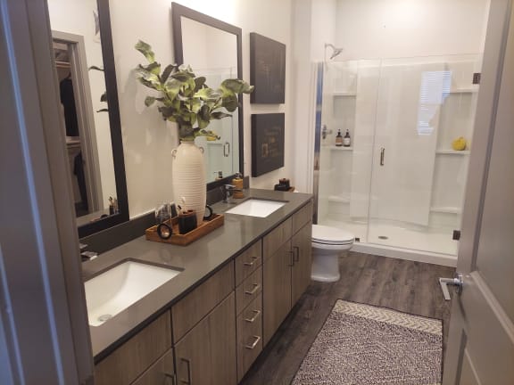 a bathroom with a large white vase with a plant on top of it at Canter, Florida