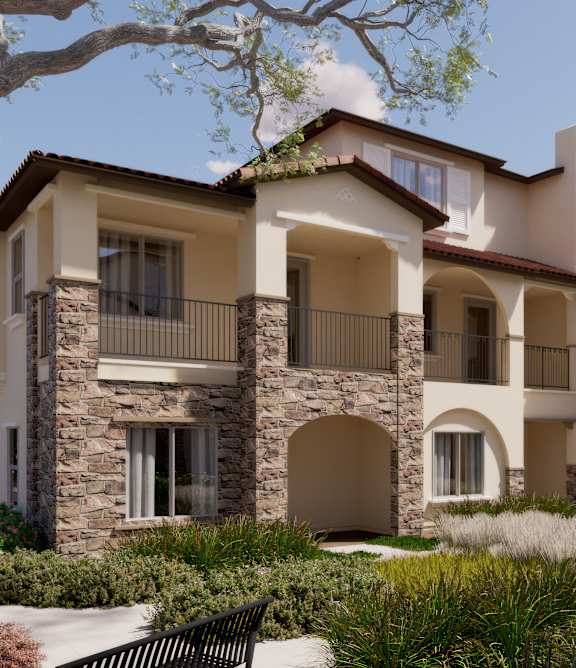 A large, multi-story residential building with balconies and arched windows.