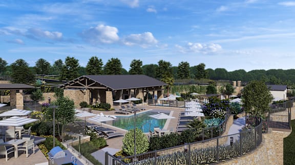 an aerial view of a resort with a swimming pool and patio area