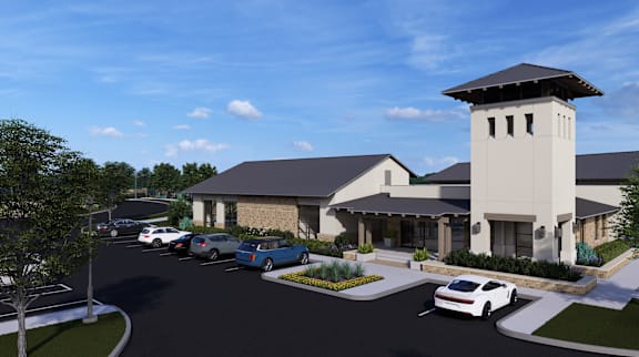 a rendering of a building with cars parked in front of it
