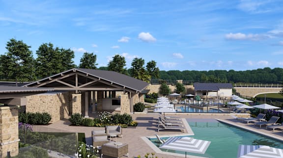 an aerial view of a resort pool with chairs and umbrellas