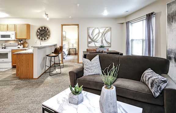 Living Room With Kitchen at Tranquility Pointe, Omaha, NE at Tranquility Pointe, Omaha, NE